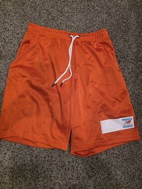 New Balance Men’s Bright Orange Mesh Athletic Shorts with White Drawcord